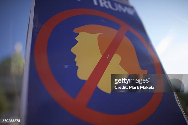 Donald Trump protestors demonstrate outside the Pennsylvania Capitol Building before electors arrive to cast their votes from the election at...