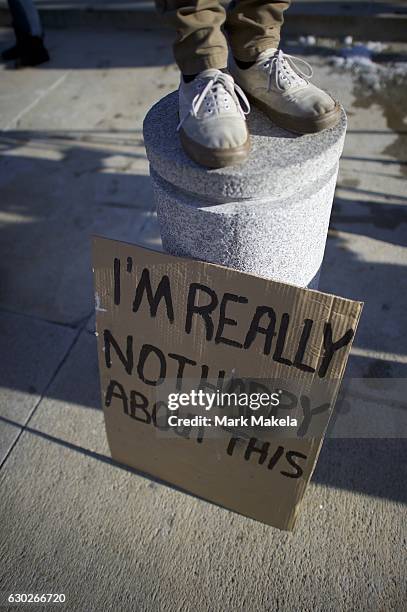 Donald Trump protestors demonstrate outside the Pennsylvania Capitol Building before electors arrive to cast their votes from the election at...