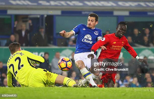 Sadio Mane of Liverpool is foiled by Leighton Baines and Maarten Stekelenburg of Everton during the Premier League match between Everton and...