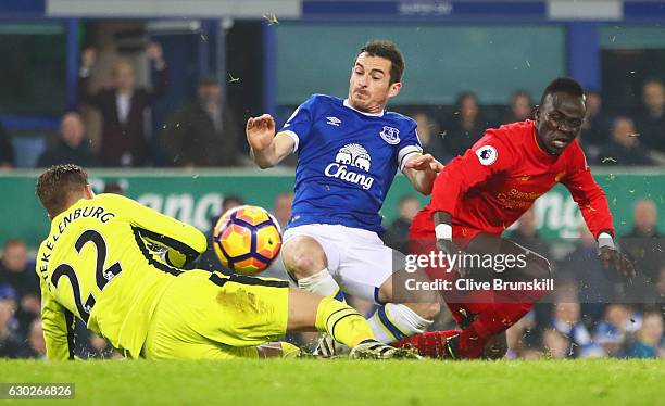 Sadio Mane of Liverpool is foiled by Leighton Baines and Maarten Stekelenburg of Everton during the Premier League match between Everton and...