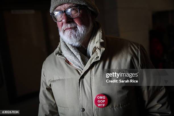 Nelson Brown, of Clarksville, warms up inside the Capitol building during a rally before the state electoral college met to cast their votes on...