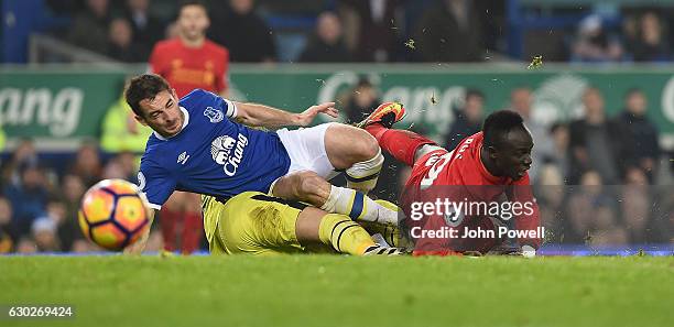 Sadio Mane of Liverpool with Leighton Baines And goalkeeper Maarten Stekelenburg of Everton during the Premier League match between Everton and...