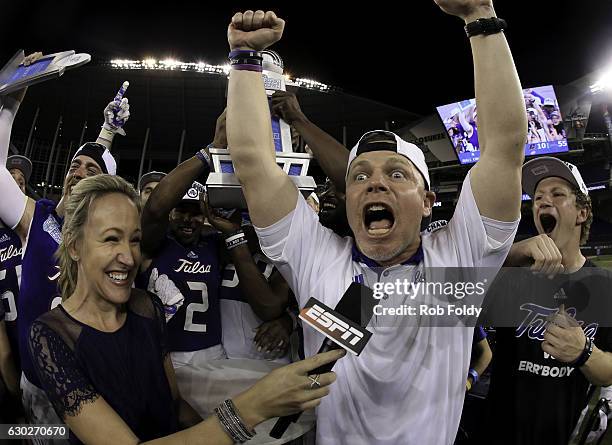 Head coach Philip Montgomery of the Tulsa Golden Hurricane celebrates during a television interview following the game against the Central Michigan...