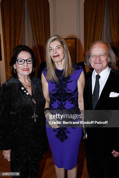Ambassador of Greece in Paris, Maria Theofili standing between Singer Nana Mouskouri and her husband Andre Chapelle attend Nana Mouskouri gives the...
