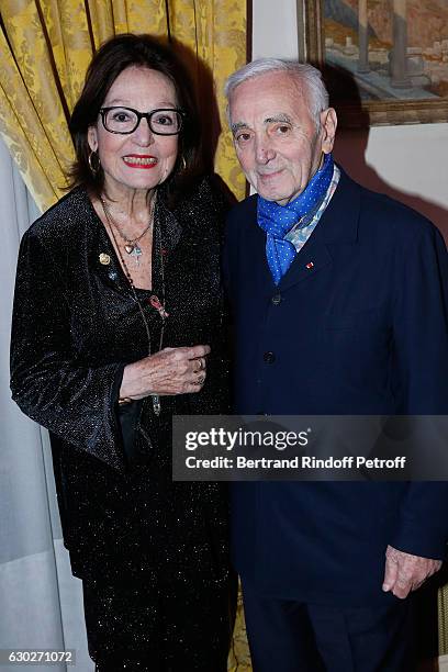 Nana Mouskouri gives the Greek Prize "Nikos Gatsos 2016" to Charles Aznavour at Embassy of Greece on December 19, 2016 in Paris, France.