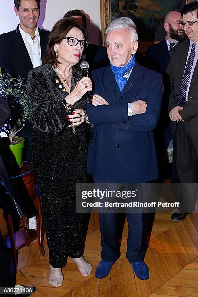 Nana Mouskouri gives the Greek Prize "Nikos Gatsos 2016" to Charles Aznavour at Embassy of Greece on December 19, 2016 in Paris, France.