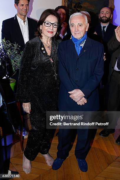 Nana Mouskouri gives the Greek Prize "Nikos Gatsos 2016" to Charles Aznavour at Embassy of Greece on December 19, 2016 in Paris, France.