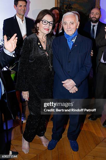 Nana Mouskouri gives the Greek Prize "Nikos Gatsos 2016" to Charles Aznavour at Embassy of Greece on December 19, 2016 in Paris, France.