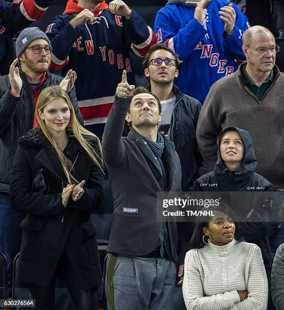 Philipa Coan, Jude Law and Iris Law are seen at Madison Square Garden on December 18, 2016 in New York City.