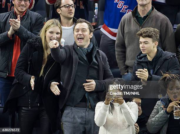 Jude Law, Iris Law, and Rudy Law are seen at Madison Square Garden on December 18, 2016 in New York City.