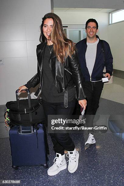 Eli Roth and Lorenza Izzo are seen at LAX on December 19, 2016 in Los Angeles, California.