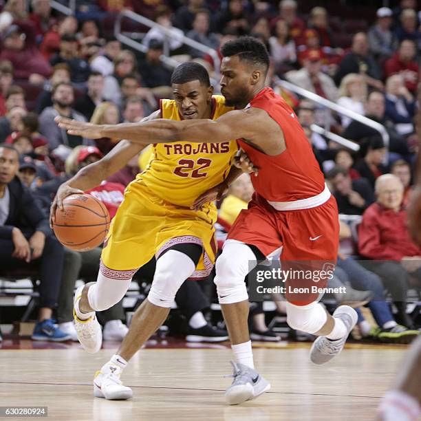 De'Anthony Melton of the USC Trojans handles the ball against Darryl Smith of the Cornell Big Red during a NCAA college basketball game at Galen...