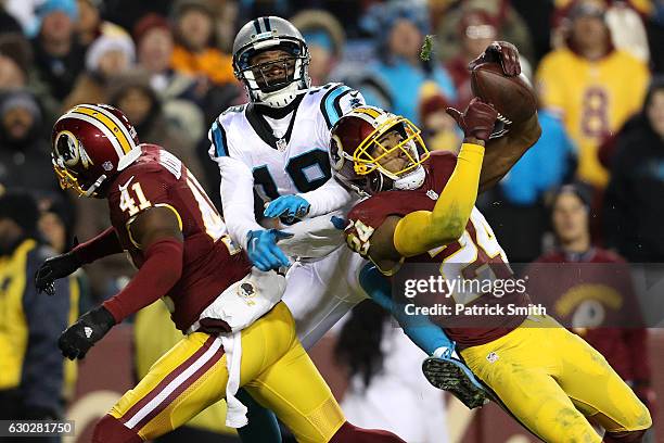 Cornerback Josh Norman of the Washington Redskins breaks up a pass intended for wide receiver Ted Ginn of the Carolina Panthers in the third quarter...