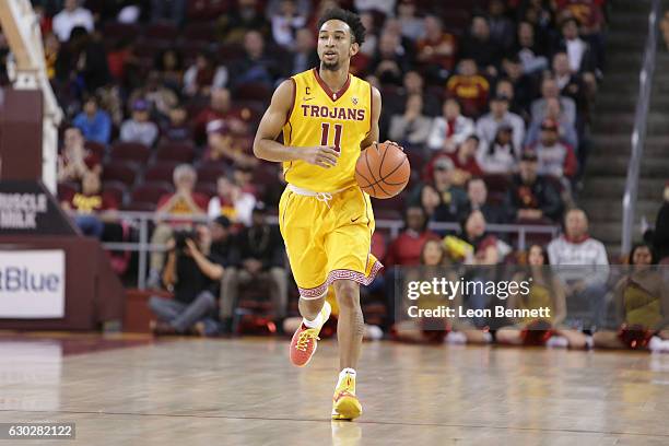 Jordan McLaughlin of the USC Trojans handles the ball against the Cornell Big Red during a NCAA college basketball game at Galen Center on December...