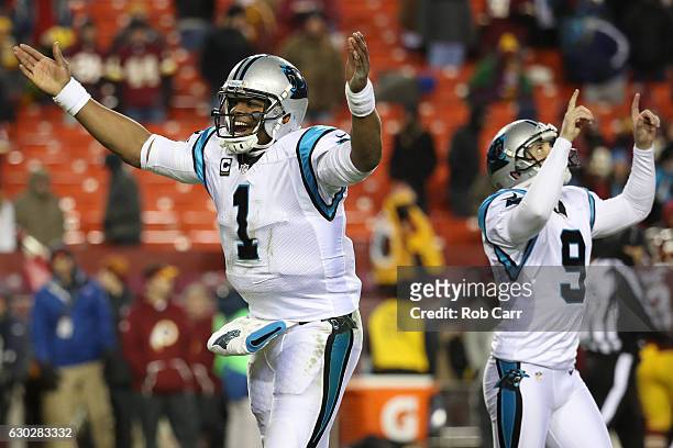 Quarterback Cam Newton of the Carolina Panthers and teammate kicker Graham Gano react after a fourth quarter field goal against the Washington...