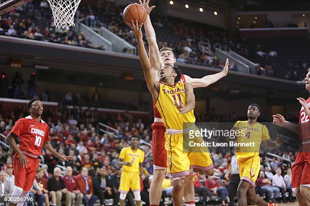 Jordan McLaughlin of the USC Trojans handles the ball against Stone Gettings of the Cornell Big Red during a NCAA college basketball game at Galen...