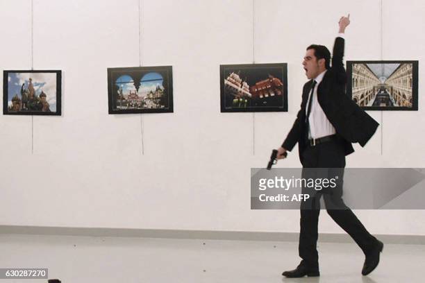 Graphic content / A picture taken on December 19, 2016 shows Mevlut Mert Altintas, the gunman who killed Russia's Ambassador to Turkey, during an...