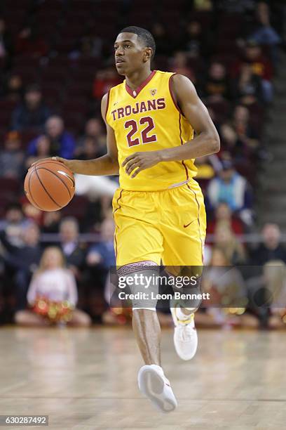 De'Anthony Melton of the USC Trojans handles the ball against the Cornell Big Red during a NCAA college basketball game at Galen Center on December...