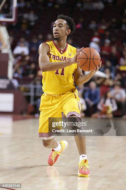 Jordan McLaughlin of the USC Trojans handles the ball against the Cornell Big Red during a NCAA college basketball game at Galen Center on December...