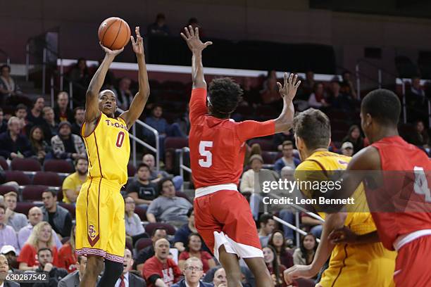 Shaqquan Aaron of the USC Trojans handles the ball against Robert Hatter of the Cornell Big Red during a NCAA college basketball game at Galen Center...