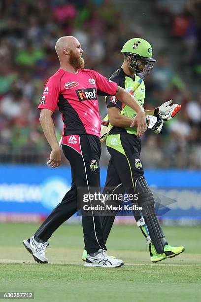 Doug Bollinger of the Sixers celebrates taking the wicket of Chris Green of the Thunder during the Big Bash League match between the Sydney Thunder...