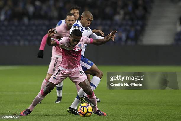 Chaves players Assis with Porto's Algerian forward Yacine Brahimi during the Premier League 2016/17 match between FC Porto and GD Chaves, at Dragao...