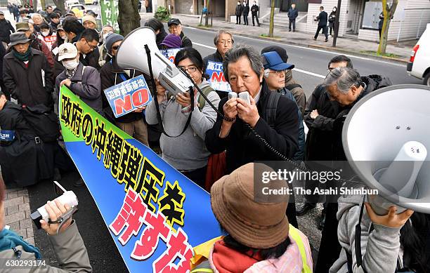 Anti-U.S. Airbase relocation protesters shout their slogans outside the Supreme Court after the verdict on December 20, 2016 in Tokyo, Japan. The...