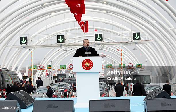 Turkish President Recep Tayyip Erdogan delivers a speech during the opening ceremony of the Eurasia Tunnel connecting Asian and European sides under...