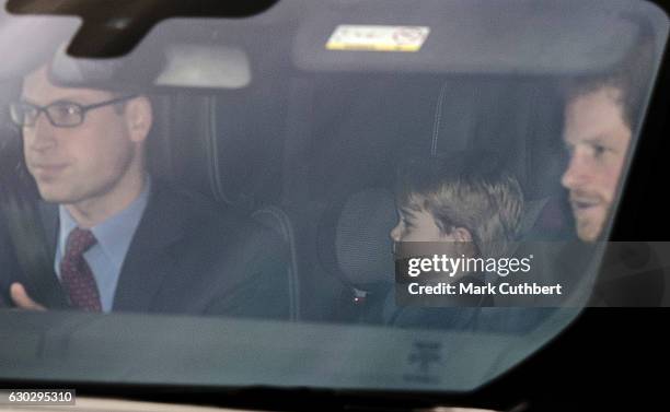 Prince William, Duke of Cambridge and Prince George of Cambridge with Prince Harry attend the annual Buckingham Palace Christmas lunch hosted by The...