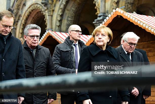 Berlin's mayor Michael Mueller, German Interior Minister Thomas de Maiziere, German Chancellor Angela Merkel and German Foreign Minister Frank-Walter...