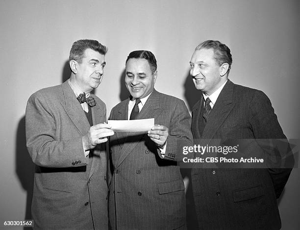 Left to right, CBS television personality Ken Murray , 1950 Nobel Peace Prize winner Dr. Ralph Bunche and Leon Steinig, a director at the United...