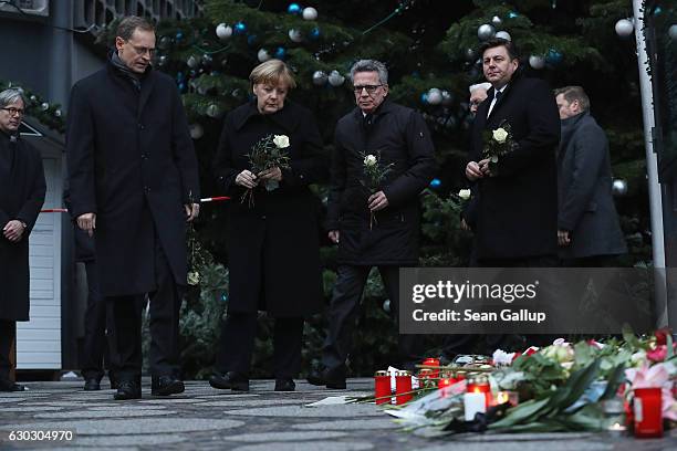 Mayor of Berlin Michael Mueller, German Chancellor Angela Merkel, German Interior Minister Thomas de Maiziere and Berlin city Interior Minister...