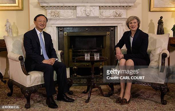 British Prime Minister Theresa May sits with Chinese State Councillor Yang Jiechi for a meeting at 10 Downing Street in London on December 20, 2016....