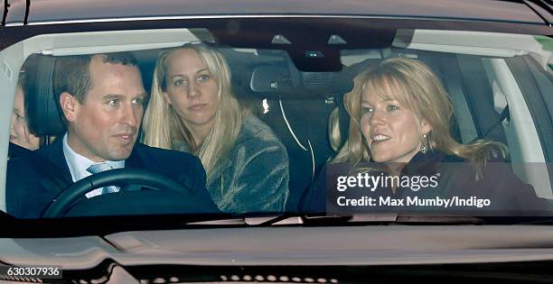 Peter Phillips and Autumn Phillips attend a Christmas lunch for members of the Royal Family hosted by Queen Elizabeth II at Buckingham Palace on...