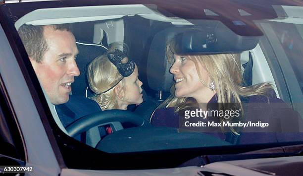 Peter Phillips, Isla Phillips and Autumn Phillips attend a Christmas lunch for members of the Royal Family hosted by Queen Elizabeth II at Buckingham...