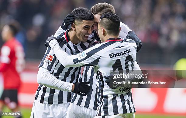 Branimir Hrgota of Frankfurt celebrates the third goal for his team with Aymane Barkok of Frankfurt and Marco Fabian of Frankfurt during the...