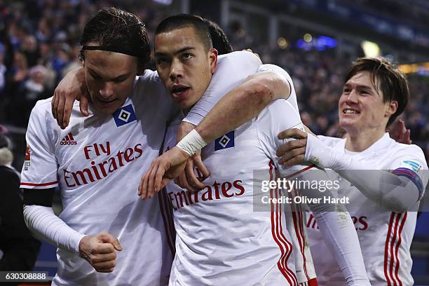 Bobby Wood of Hamburg celebrates with teammates after scores his team's first goal during the Bundesliga match between Hamburger SV and FC Schalke 04...