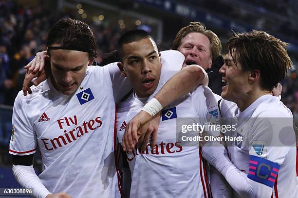 Bobby Wood of Hamburg celebrates with teammates after scores his team's first goal during the Bundesliga match between Hamburger SV and FC Schalke 04...