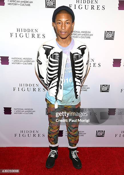 Singer/songwriter Pharrell Williams arrives at the "Hidden Figures" Washington, DC Screening at National Museum of African American History & Culture...