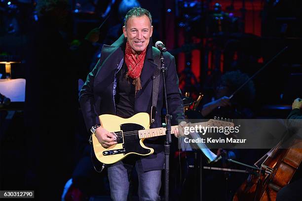 Bruce Springsteen performs onstage during The Revlon Concert for the Rainforest Fund, "Baby It's Cold Outside" at Carnegie Hall on December 14, 2016...