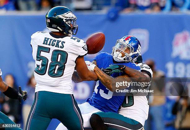 Jaylen Watkins and Jordan Hicks of the Philadelphia Eagles defend against Odell Beckham of the New York Giants on November 6, 2016 at MetLife Stadium...