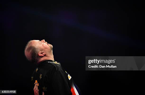 Raymond van Barneveld of the Netherlands reacts after defeating Robbie Green of Great Britain during the first round match on day six of the 2017...