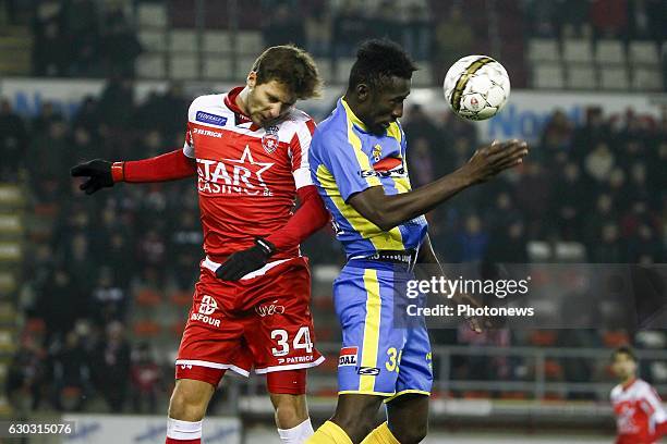 Stefan Simic defender of Royal Excel Mouscron in an airduel with Silvere Ganvoula forward of KVC Westerlo during the Jupiler Pro League match between...