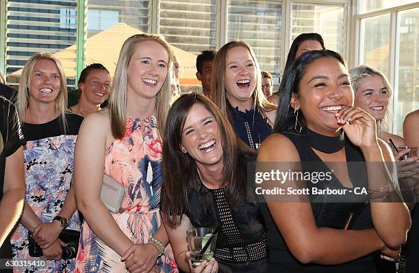 Anna Lanning, Kristen Beams, Gemma Triscari and Alana King of the Stars WBBL side laugh as Stars coach Stephen Fleming sings the Melbourne Stars BBL...