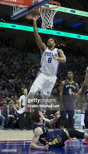 Jahlil Okafor of the Philadelphia 76ers attempts a lay up against Omer Asik of the New Orleans Pelicans in the second quarter at Wells Fargo Center...