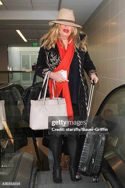 Jennifer Coolidge is seen at LAX on December 20, 2016 in Los Angeles, California.