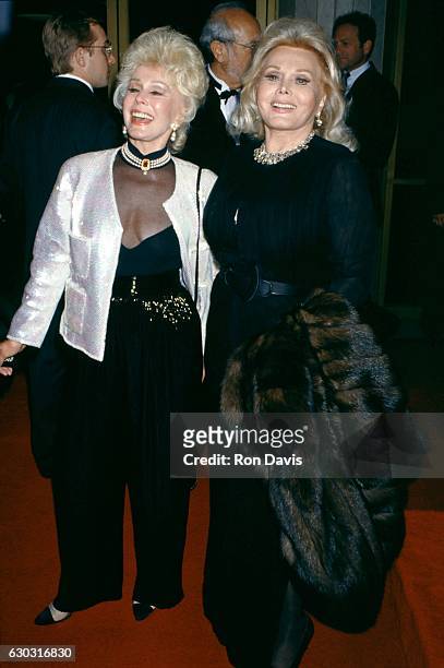 Eva Gabor and Zsa Zsa Gabor arrive during "That's Entertainment III" Westwood Premiere on April 28, 1994 at the Mann's National Theater in Westwood,...