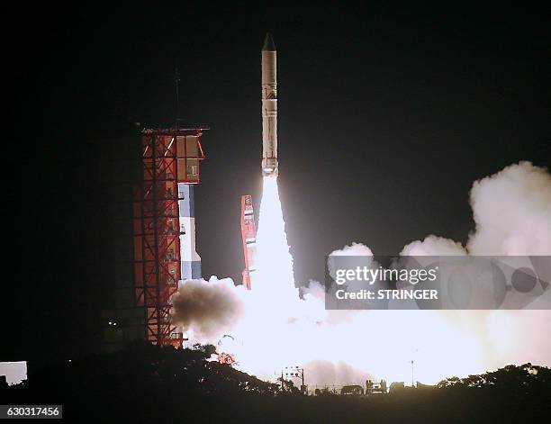 In this picture taken on December 20 Japan's Epsilon rocket, carrying the JAXA ERG satellite that will study the earth's magnetosphere, is launched...