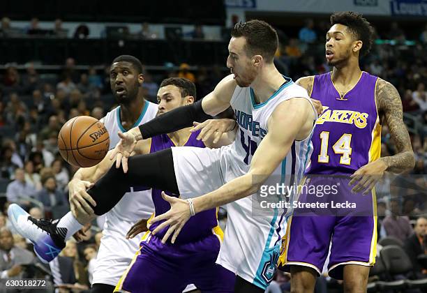 Teammates Larry Nance Jr. #7 and Brandon Ingram of the Los Angeles Lakers go after a loose ball against teammates Roy Hibbert and Frank Kaminsky III...