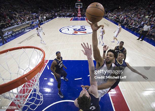 Jahlil Okafor of the Philadelphia 76ers shoots the ball against Omer Asik of the New Orleans Pelicans in the second quarter at Wells Fargo Center on...